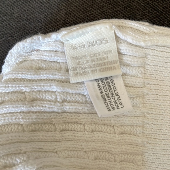 6-9 months cream knit hat 100% cotton in between a white and cream color - Picture 2 of 2